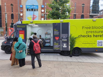 The Kinetik exhibition van, from the outside, as guests look on