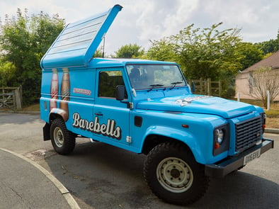 Showing the Barebells Land Rover conversion, with the roof open.