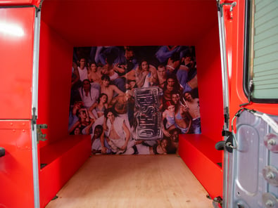 A false wall display in the red Diesel Land Rover Defender.