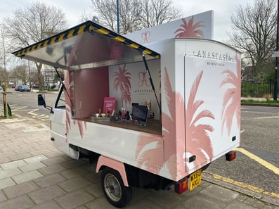 The Boots Piaggio Ape hire, seen from the rear and side.