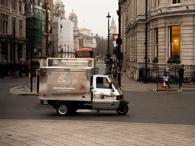 The Dermalogica Piaggio Ape seen taking to the London roads from afar.