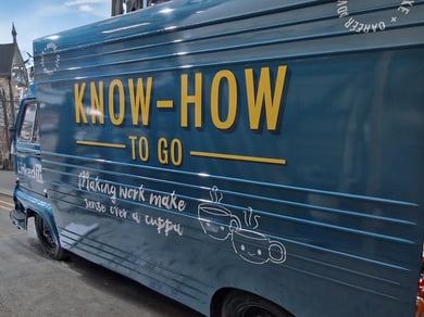 A Renault Estafette food sampling vehicle in blue, with bold yellow branding on the side.