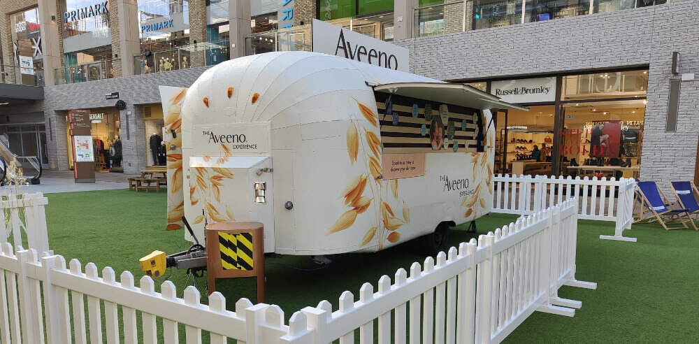 Aveeno Airstream in place thanks to location planning, between permanent shops