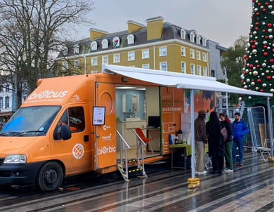 The BiOrbic biobus open with a crowd at Christmas.