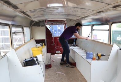 Brutal Fruit Routemaster bus vehicle design and build - A member of Promohire working on the fit out