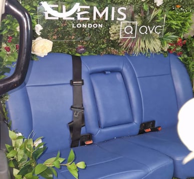 Inside the Elemis and QVC taxi, with blue seating.