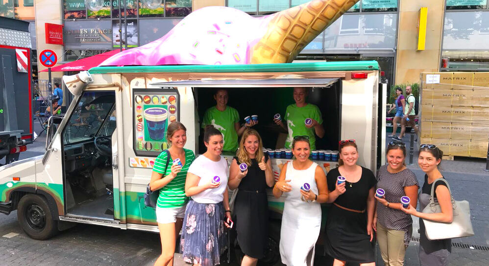 The Fortnite Utilimaster American truck with a crowd of women posing for a photo.