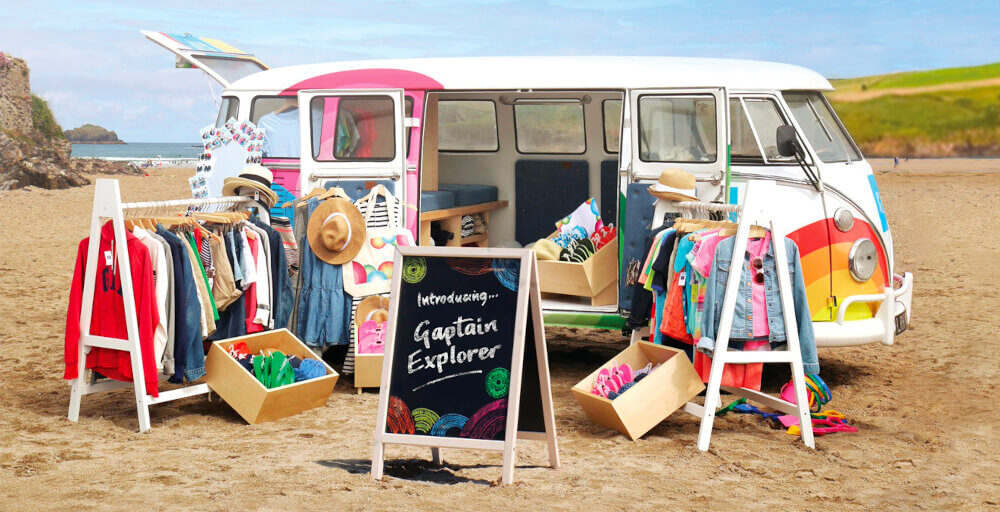 GAP VW Campervan hire, sat on the beach with clothing displays