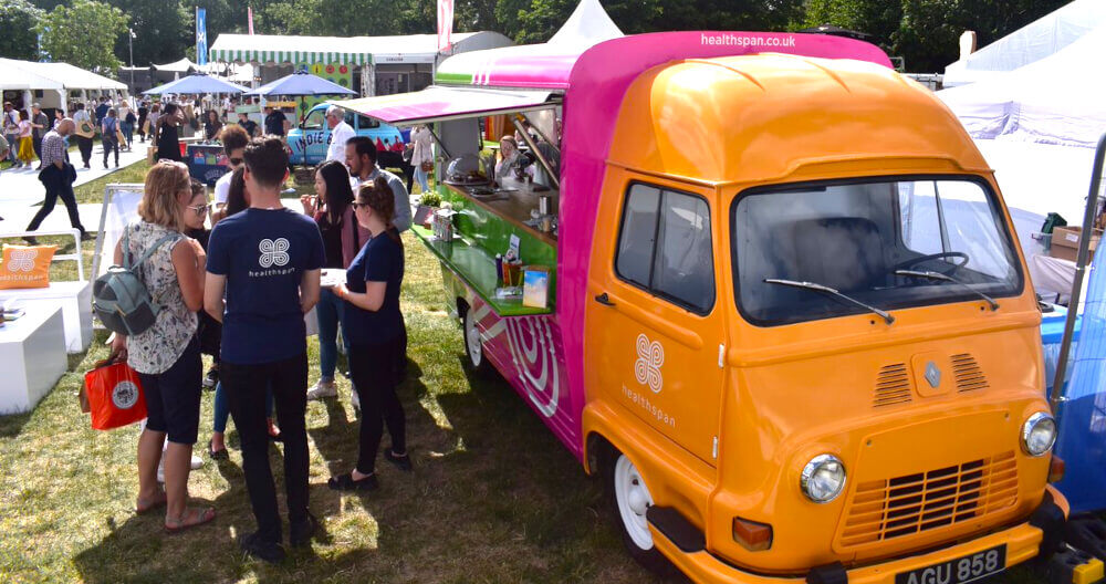 Healthspan Renault Estafette, parked in a festival with guests around.