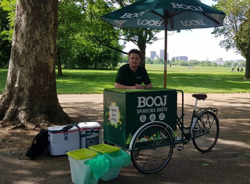 Booj promotional bike set up in a city park - an ideal product sampling location