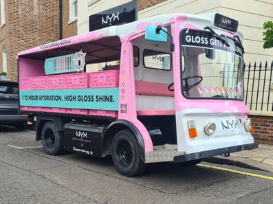 NYX electric milk float on the road - The front of the vehicle.