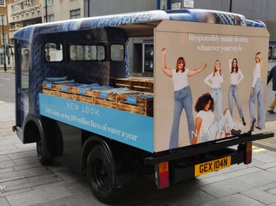 The New Look electric milk float, with boxes of jeans ready to be given to the public and media outlets.