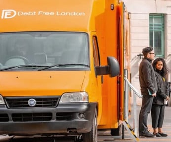 Debt Free London Orange Exhibition vehicle