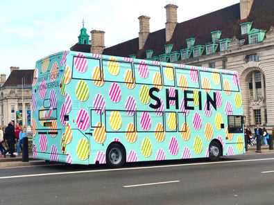 SHEIN easter bus on the road in London.