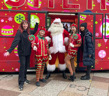 The ShEIN Christmas bus with brand ambassadors and Santa Claus.