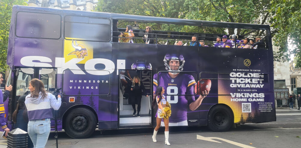 A purple open-top double-decker bus, hired by NFL.