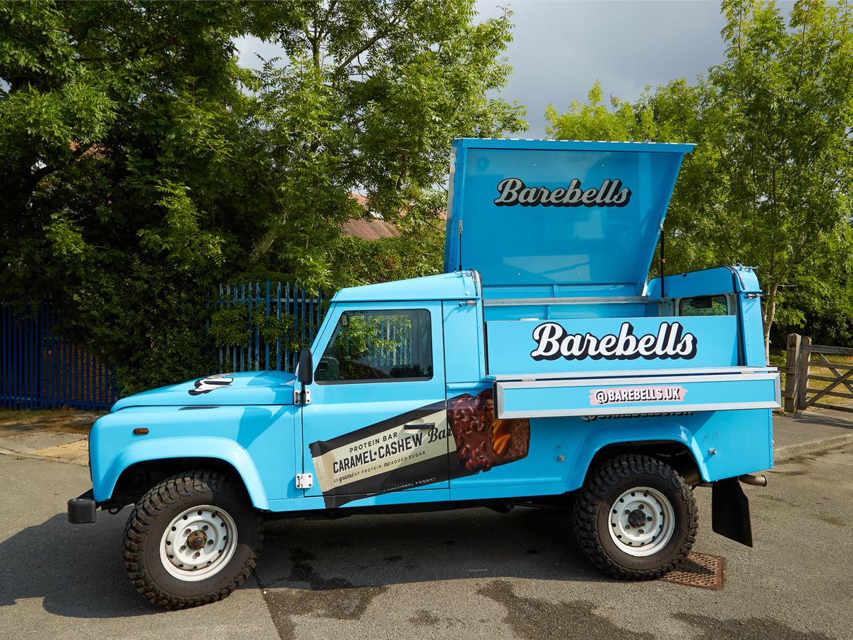 The custom blue Barebells Land Rover Defender hire.